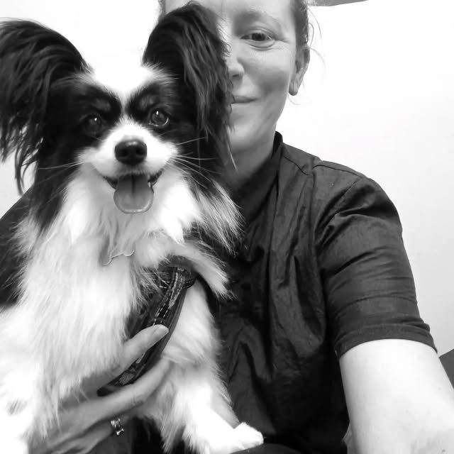 Holly holding a papillon cheek to cheek